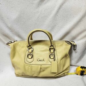 Yellow Coach bag with dust cover